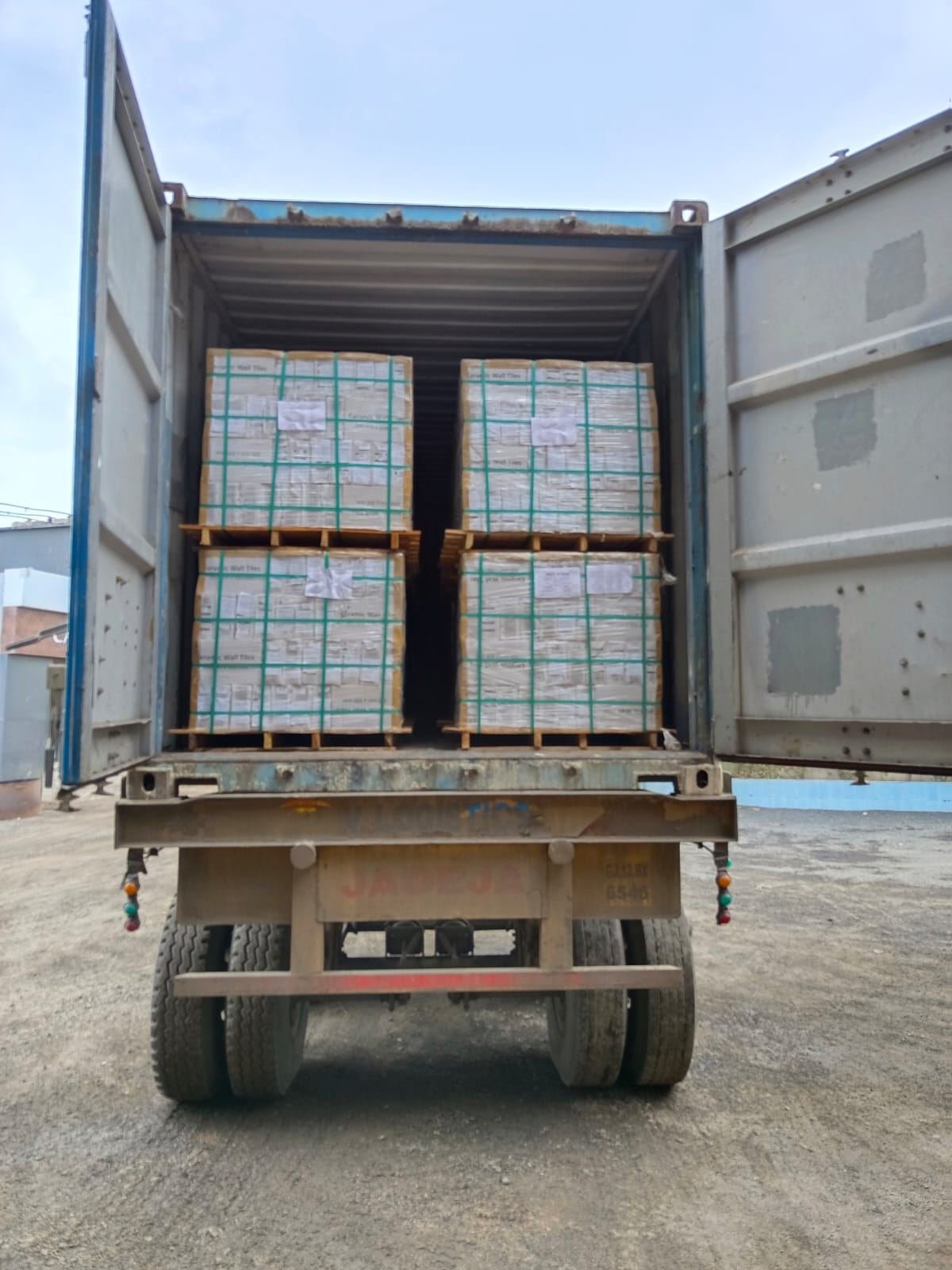 Ceramic wall tile pallets strapped and loaded into a container