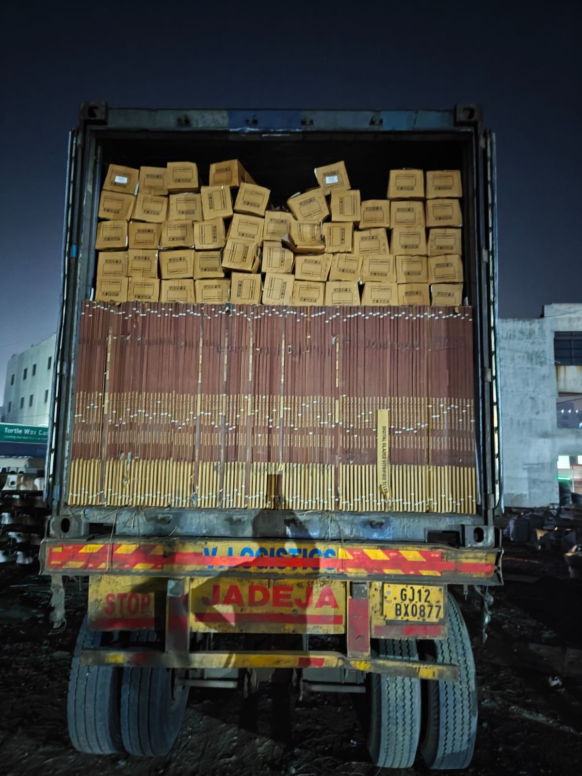 Vitrified tile cartons floor-loaded into a container